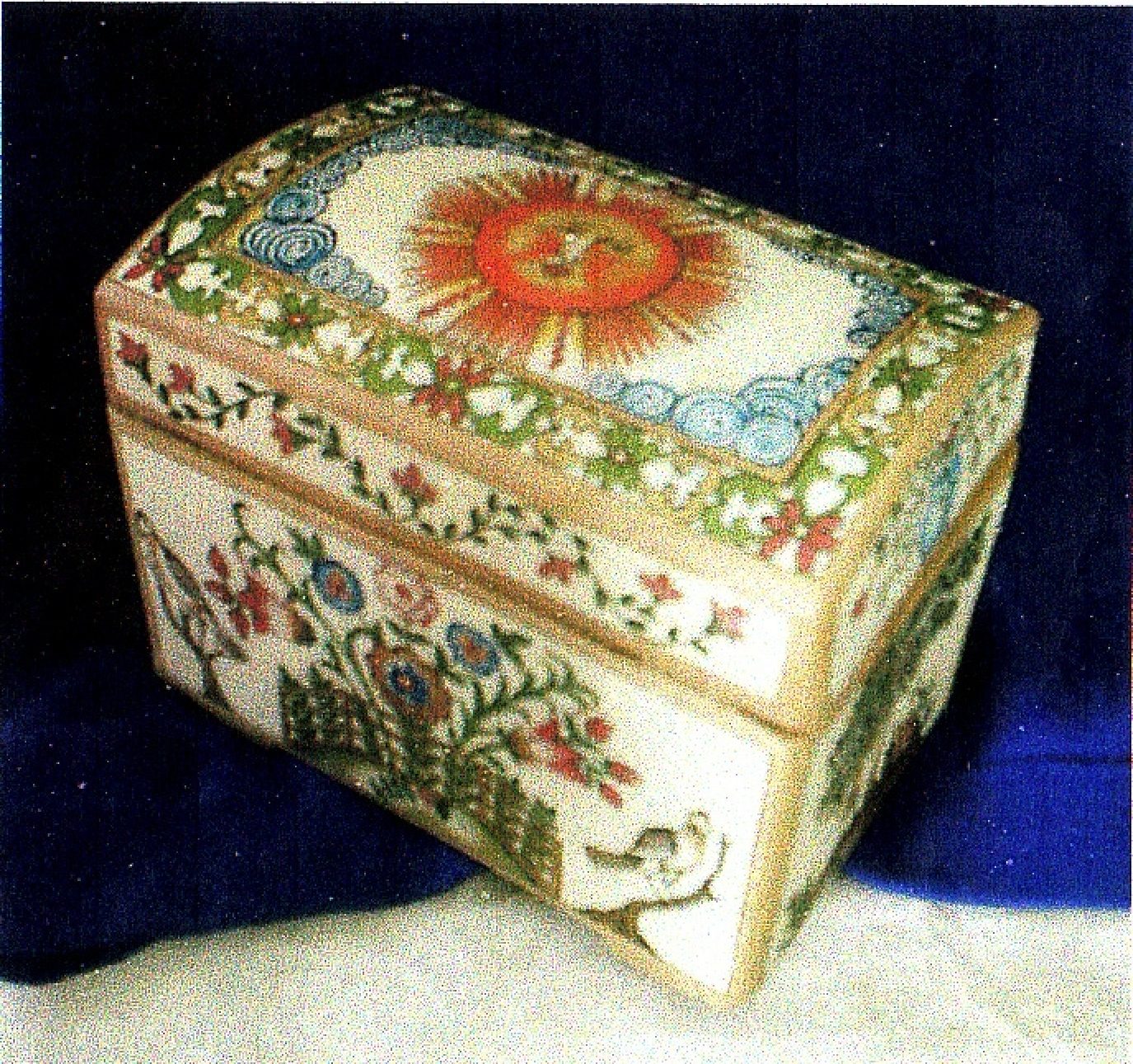 Clay chest hand-modeled and hand-painted with floral motifs