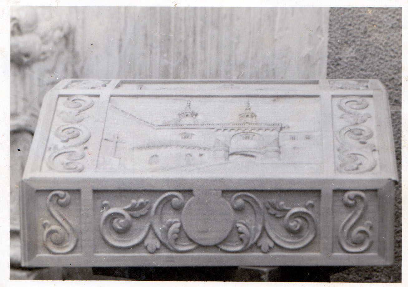 Hand-carved wooden secretary desk with colonial reliefs
